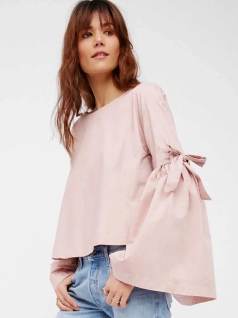 Free People "So Obviously Yours" pink top with distinctive bell sleeves